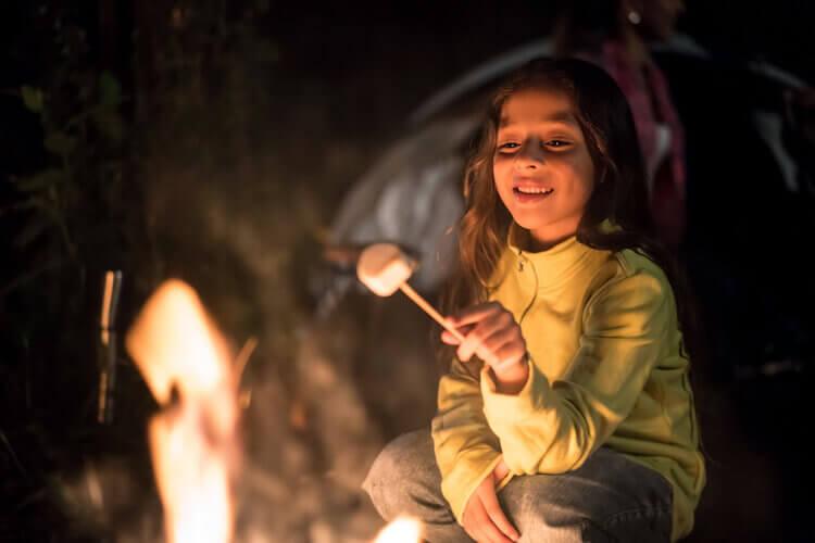 Roofnest Blog, Girl roasting marshmellow||