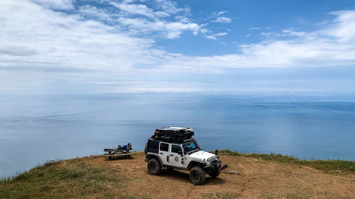 Sandpiper rooftop tent on jeep with surfboards attached|Rooftop Tent Surfing Baja